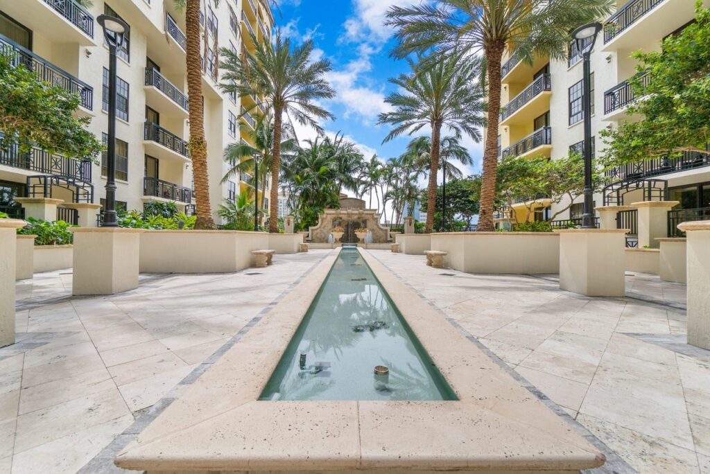 Seventh-floor courtyard with waterfall fountain at One City Plaza West Palm Beach