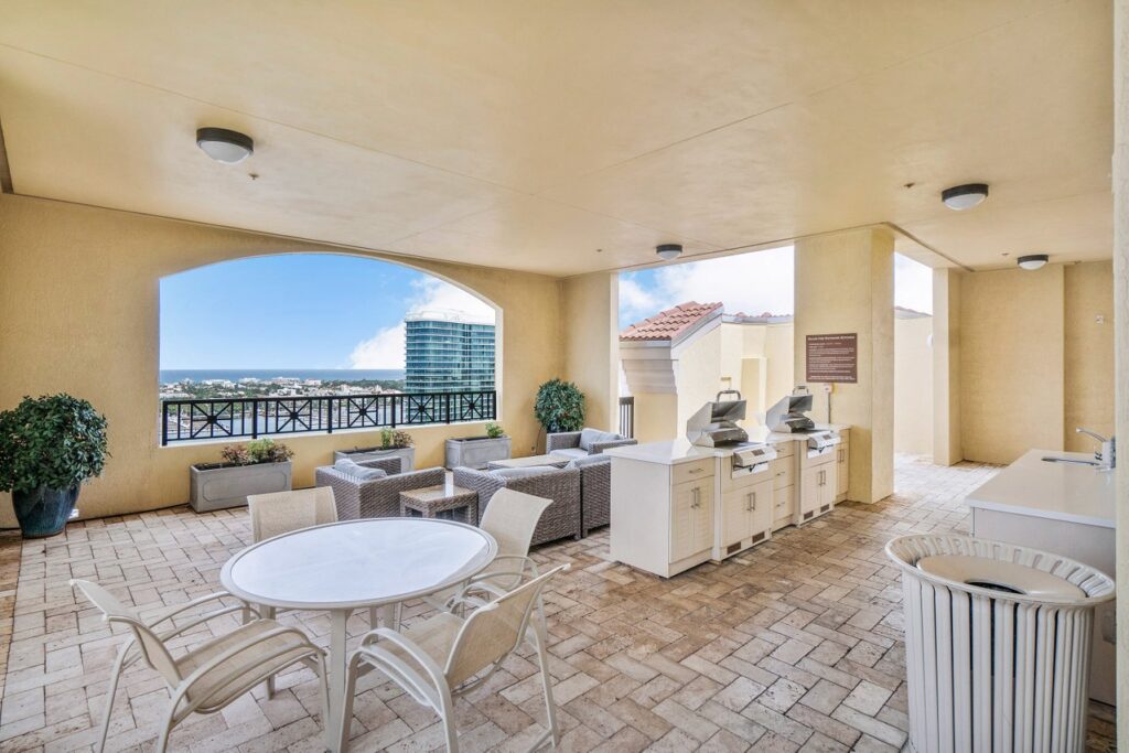 Covered rooftop lounge with grills and Intracoastal views at One City Plaza West Palm Beach