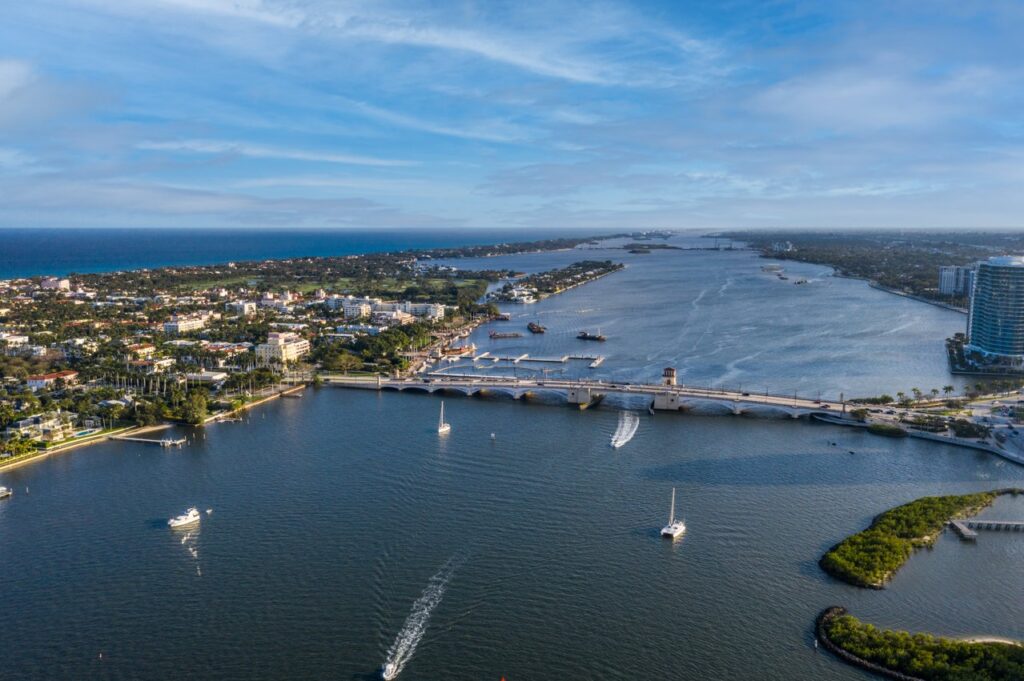 Aerial view of the Royal Park Bridge over the Intracoastal Waterway, with Palm Beach and the Atlantic Ocean beyond
